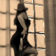 A woman dances and then takes a shit on the floor.